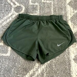 Selling a pair of olive green, Nike running shorts.